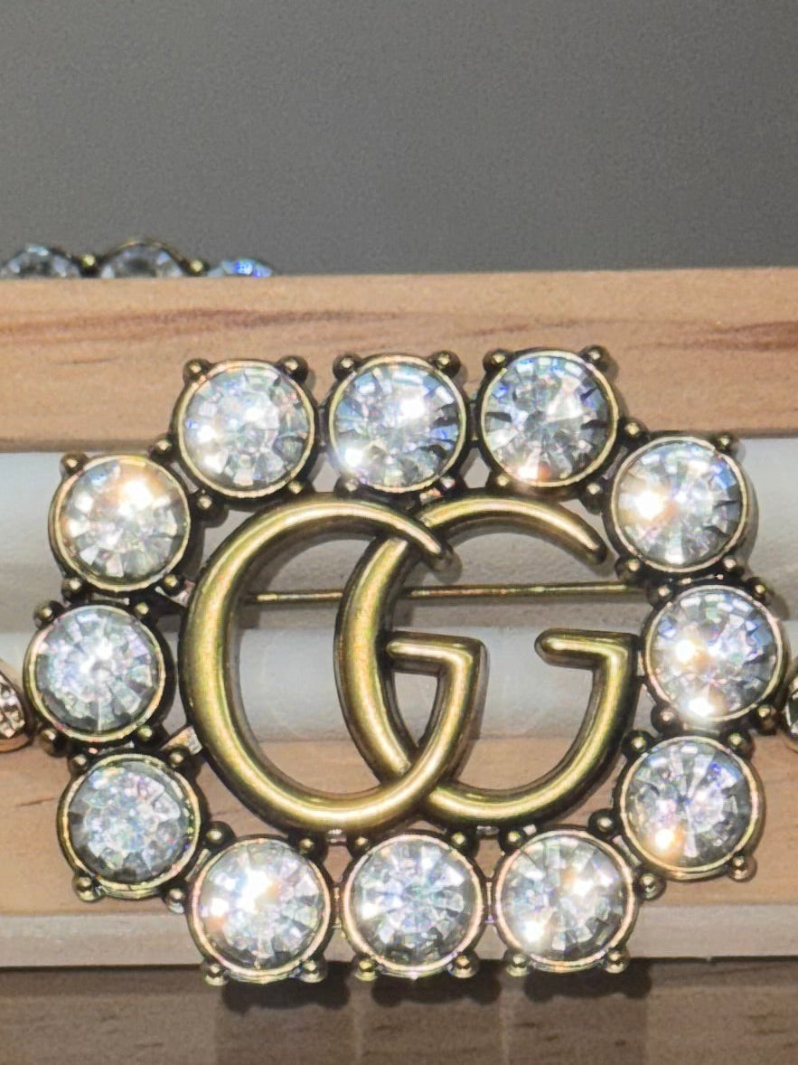 Aretes & brooch gold gg